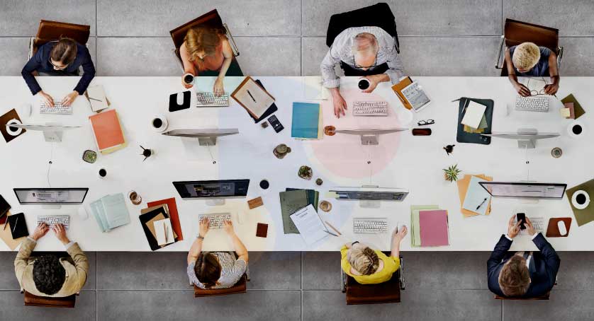 digital marketers working around a work desk